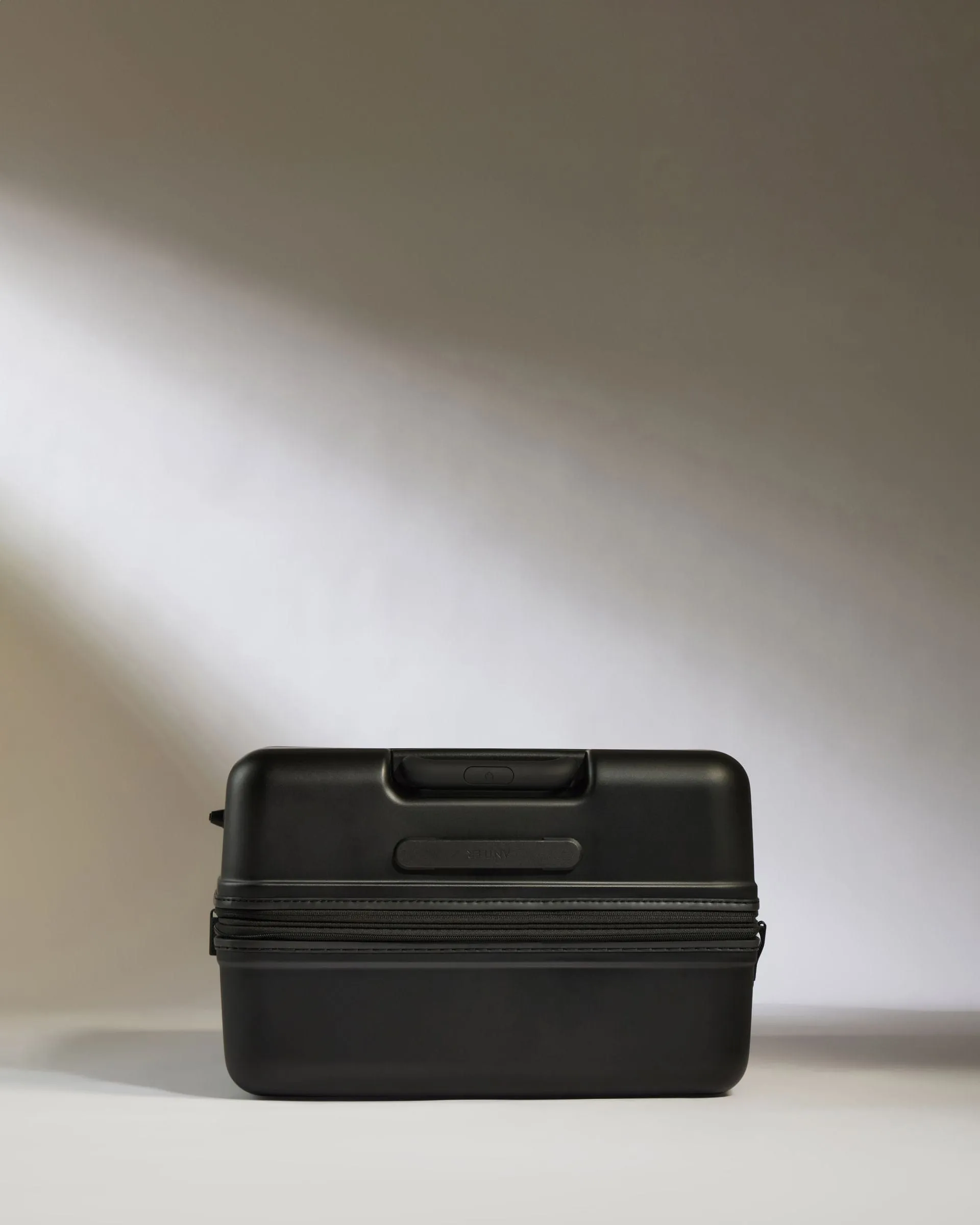 Large Suitcase in Black - Icon Stripe