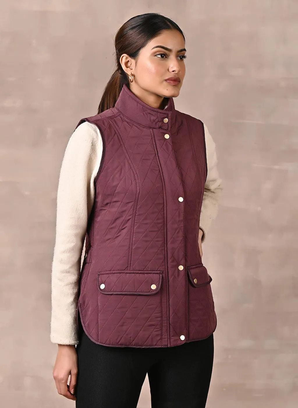 Maroon Solid Sleeveless Quilted Jacket With Rivets Detail & Curved Hem